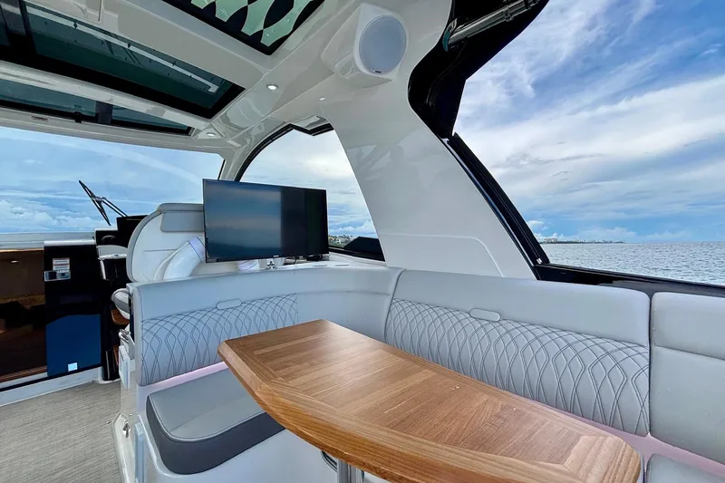 Slide: The Image of Luxurious interior of 2022 Sea Ray Sundancer 370 Outboard with ocean view. - 30