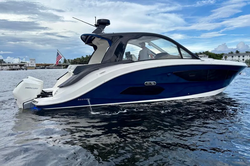 Slide: The Image of 2022 Sea Ray Sundancer 370 Outboard on water, showcasing sleek design and powerful Mercury engines. - 37