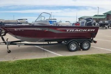 Slide: The Image of 2018 Tracker Targa V-18 Combo boat on trailer in parking lot. - 10