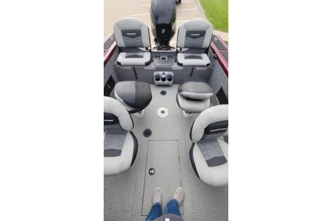 Slide: The Image of 2018 Tracker Targa V-18 Combo boat interior with seating and motor view. - 13