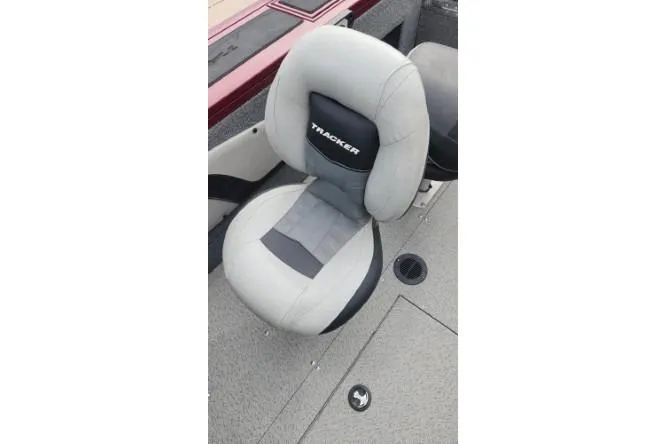 Slide: The Image of 2018 Tracker Targa V-18 Combo boat seat, gray and black design. - 17