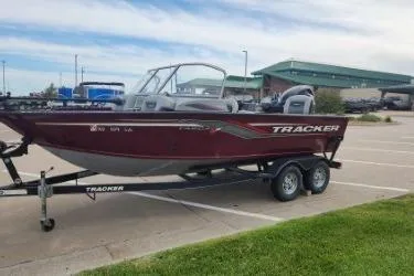 Slide: The Image of 2018 Tracker Targa V-18 Combo boat on trailer in parking lot. - 9