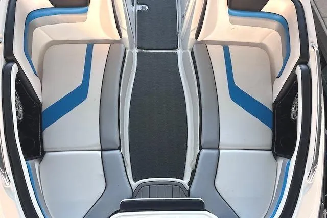 Slide: The Image of 2016 Yamaha Boats 242X E-Series with sleek seating and modern design by the water. - 10