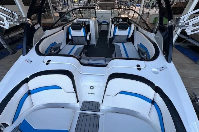 Slide: The Image of 2016 Yamaha Boats 242X E-Series interior with stylish seating and modern design on the water. - 13