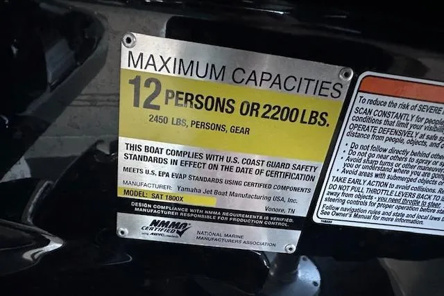 Slide: The Image of 2016 Yamaha Boats 242X E-Series covered on trailer, parked outdoors. - 17