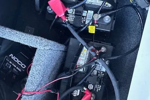 Slide: The Image of Captain's seat of 2016 Yamaha Boats 242X E-Series, featuring sleek design and blue accents. - 22