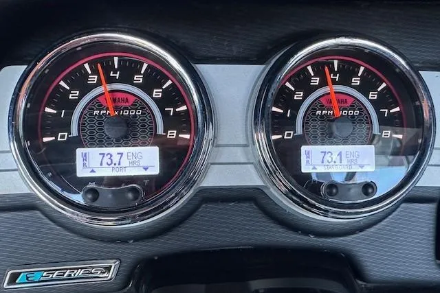 Slide: The Image of 2016 Yamaha Boats 242X E-Series seat with blue accents and armrests. - 23