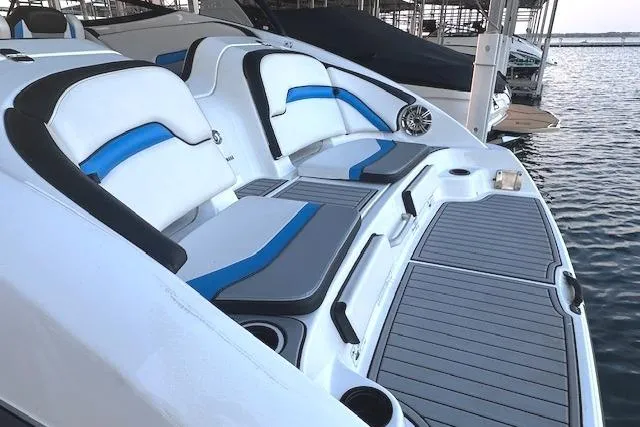 Slide: The Image of 2016 Yamaha Boats 242X E-Series docked, featuring sleek design and vibrant blue accents. - 7