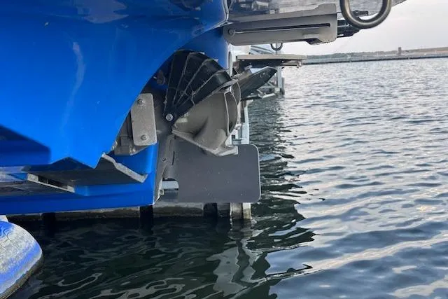 Slide: The Image of 2016 Yamaha Boats 242X E-Series docked in a marina, side view. - 8