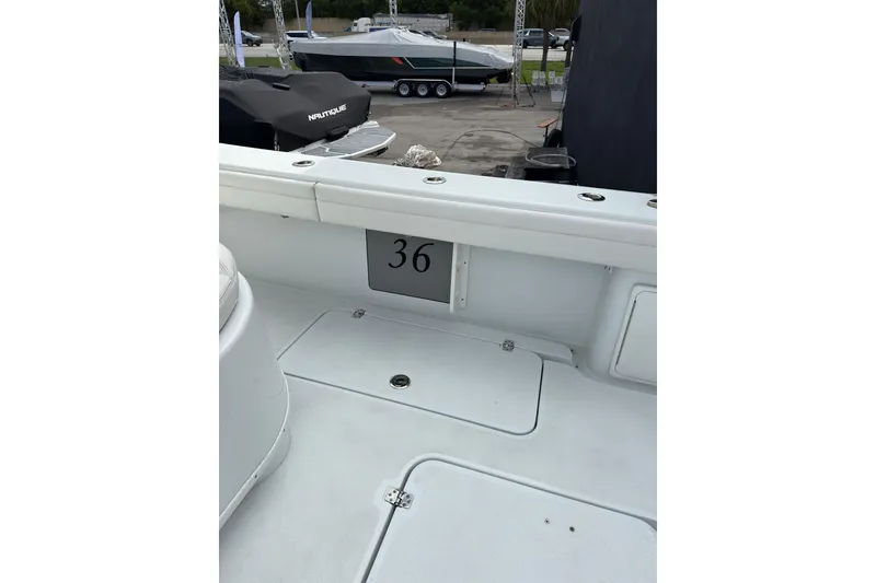 Slide: The Image of 2021 Yellowfin 36 Offshore boat interior with storage compartments. - 13