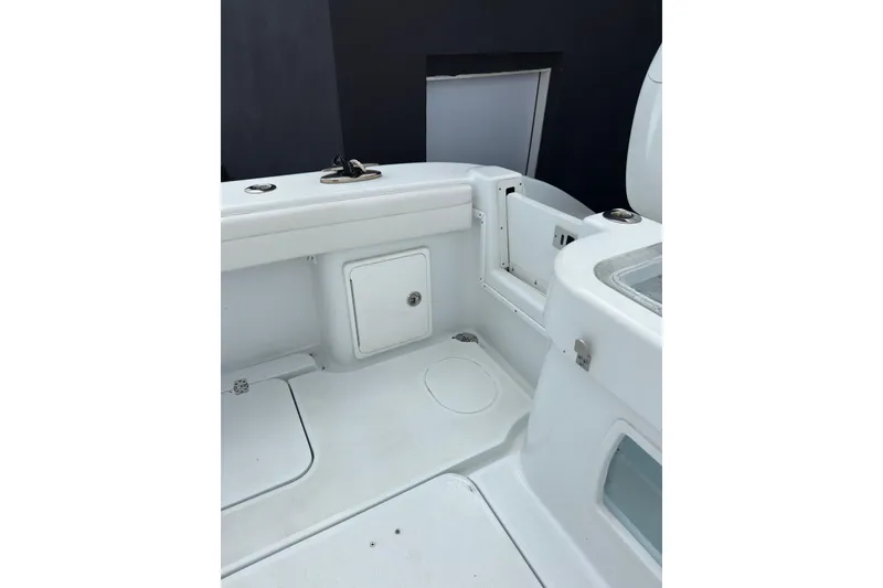 Slide: The Image of 2021 Yellowfin 36 Offshore boat interior with storage compartments and seating area. - 16