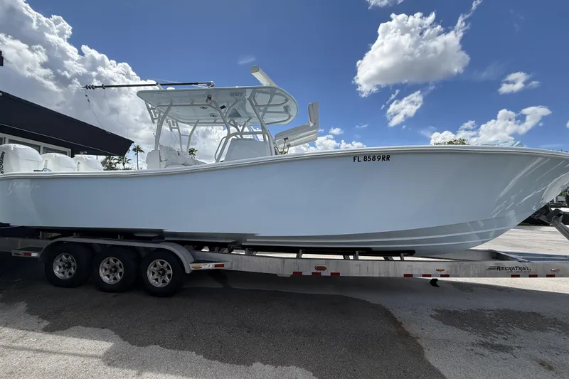 Slide: The Image of 2021 Yellowfin 36 Offshore boat on trailer under a blue sky. - 4