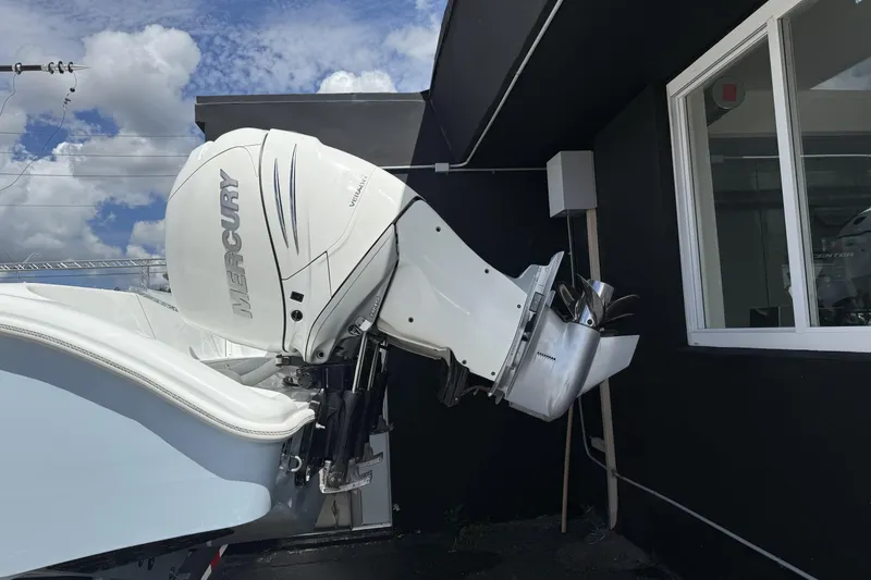 Slide: The Image of 2021 Yellowfin 36 Offshore with Mercury outboard engine, parked near a building. - 8