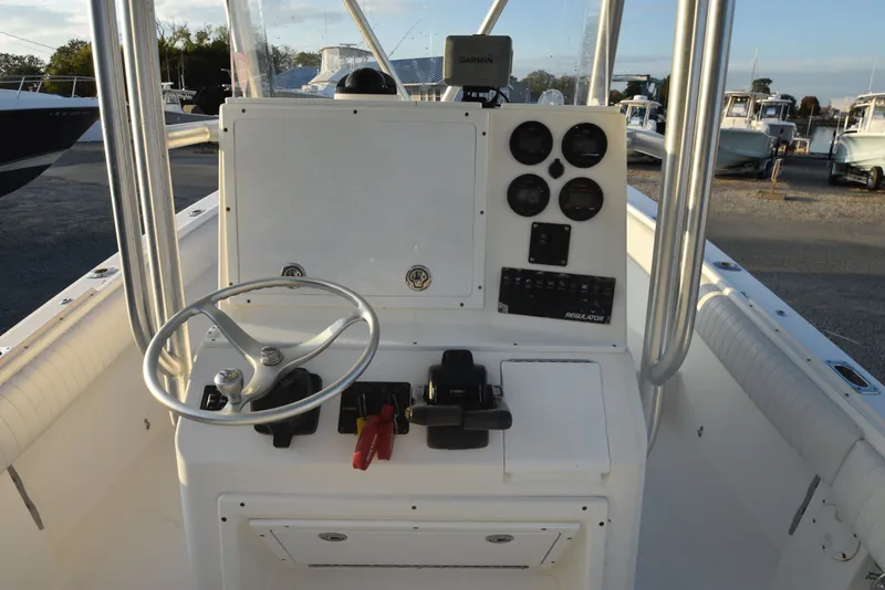 Slide: The Image of 2005 Regulator 24 Forward Seating boat console with steering wheel and gauges. - 15