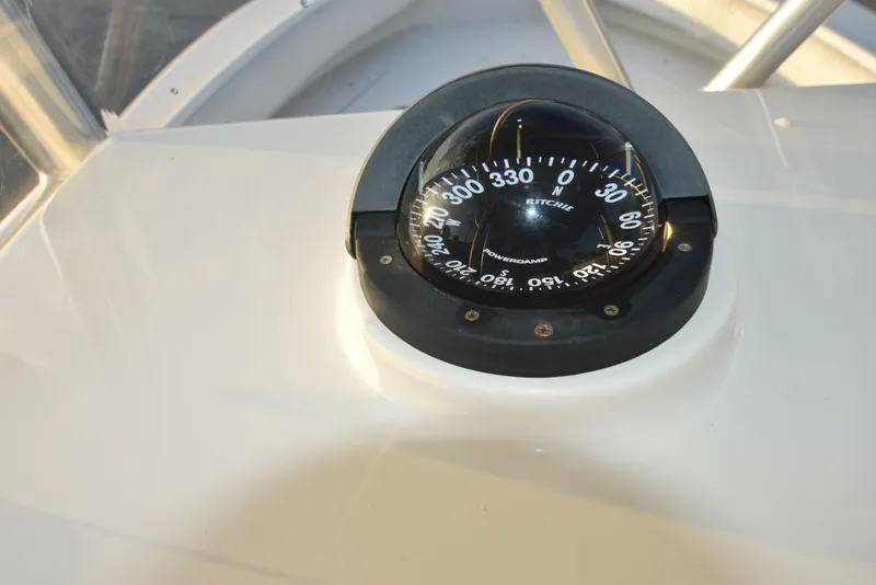 Slide: The Image of Compass on 2005 Regulator 24 Forward Seating boat dashboard. - 19