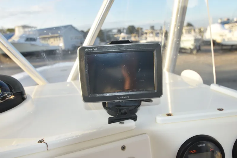 Slide: The Image of 2005 Regulator 24 Forward Seating boat dashboard with Garmin GPSmap 640. - 20