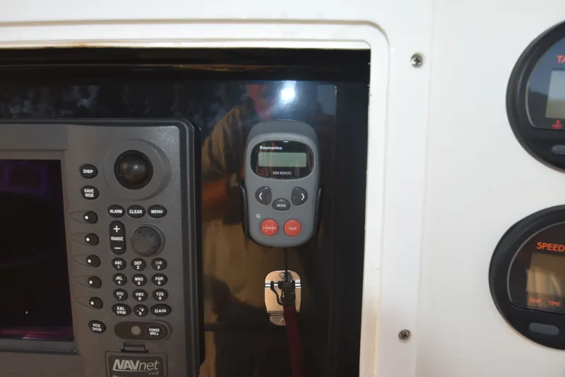 Slide: The Image of Control panel of a 2005 Regulator 24 Forward Seating boat with navigation equipment. - 27