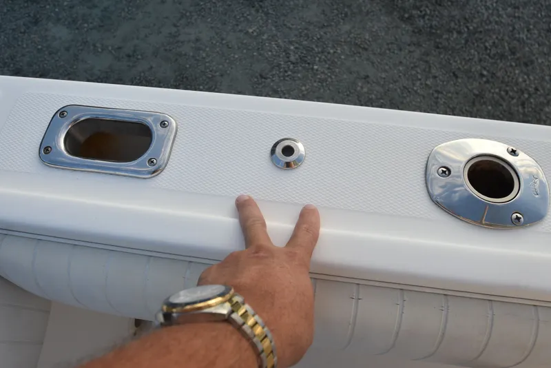 Slide: The Image of 2005 Regulator 24 Forward Seating boat detail with chrome fittings and textured surface. - 32