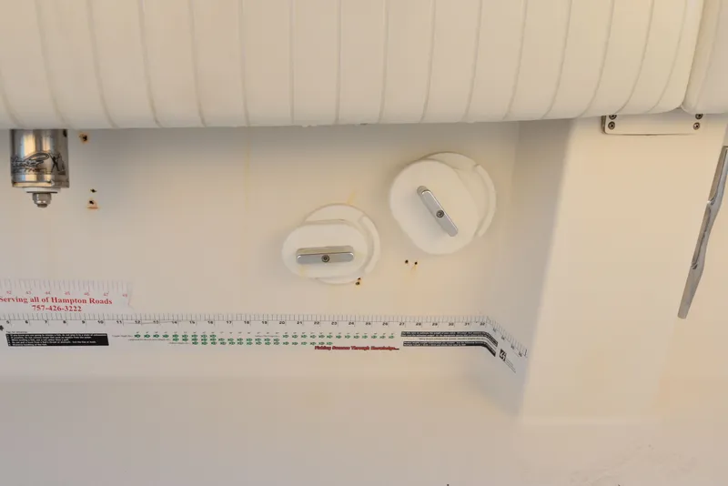 Slide: The Image of 2005 Regulator 24 Forward Seating boat interior with measurement scale and fittings. - 35