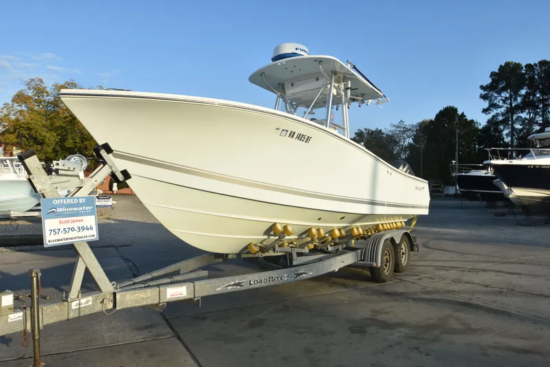 Slide: The Image of 2005 Regulator 24 Forward Seating boat on trailer at dealership. - 6