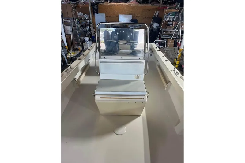 Slide: The Image of 2009 Parker 2100 Special Edition boat interior with console and seating. - 6