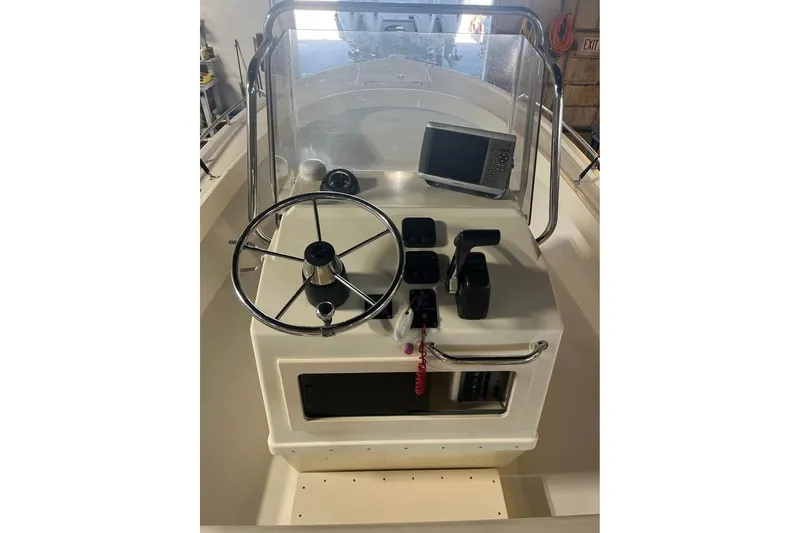 Slide: The Image of 2009 Parker 2100 Special Edition boat console with steering wheel and navigation equipment. - 7