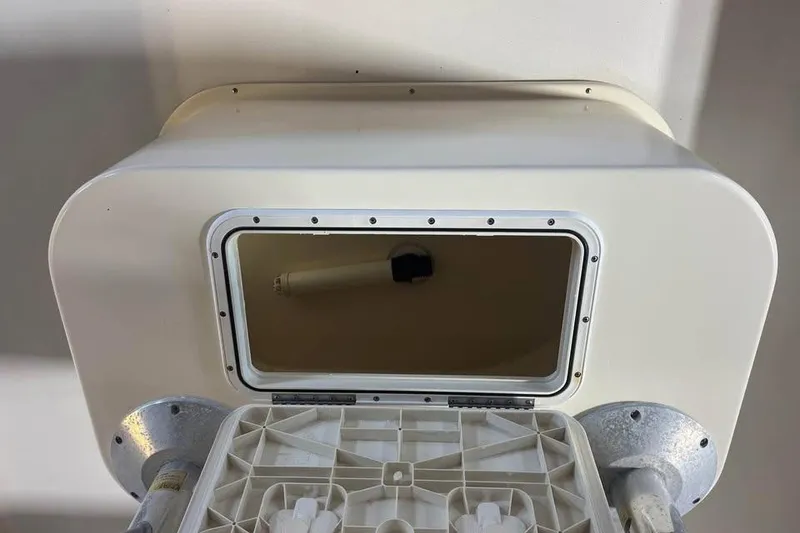 Slide: The Image of Open hatch on a 2009 Parker 2100 Special Edition boat, showing interior compartment. - 8