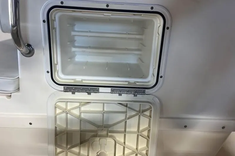 Slide: The Image of Open storage compartment on a 2009 Parker 2100 Special Edition boat. - 9