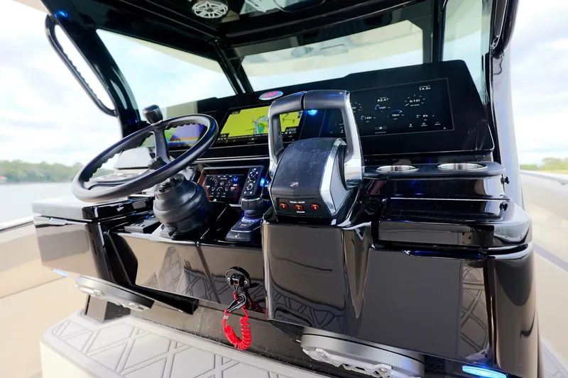 Slide: The Image of 2024 Scout 377 LXF boat dashboard with advanced navigation and control systems. - 28