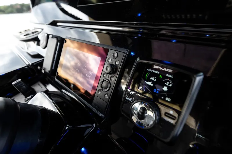 Slide: The Image of 2024 Scout 377 LXF dashboard with advanced navigation and control systems. - 33