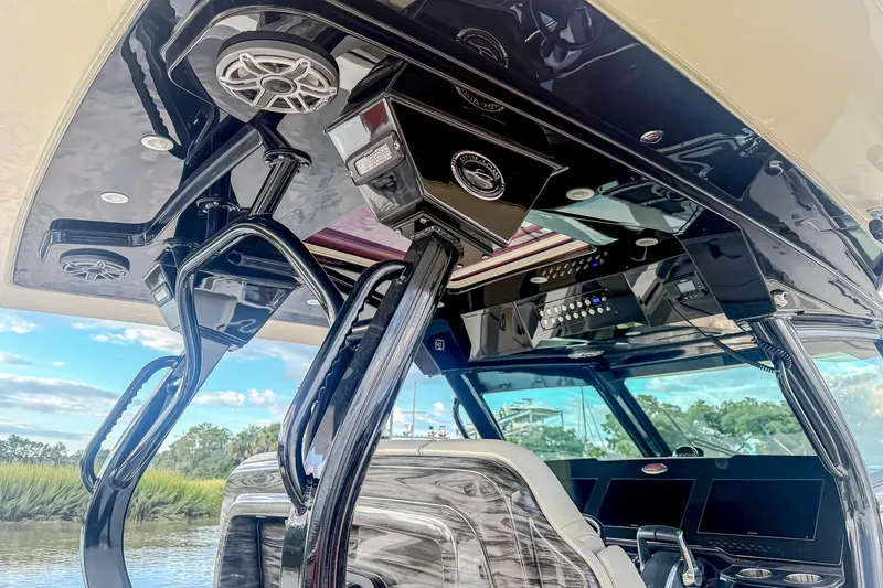 Slide: The Image of 2024 Scout 377 LXF boat interior with advanced audio system and sleek design. - 36