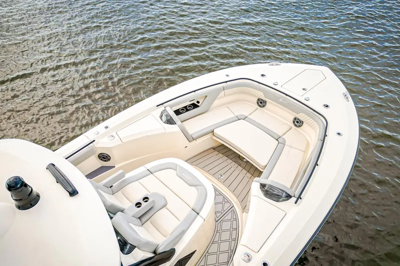 Slide: The Image of 2024 Scout 377 LXF boat with luxurious seating on calm water. - 4