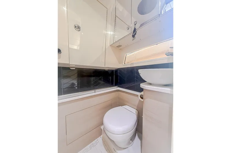Slide: The Image of 2024 Scout 377 LXF boat bathroom with modern fixtures and sleek design. - 83