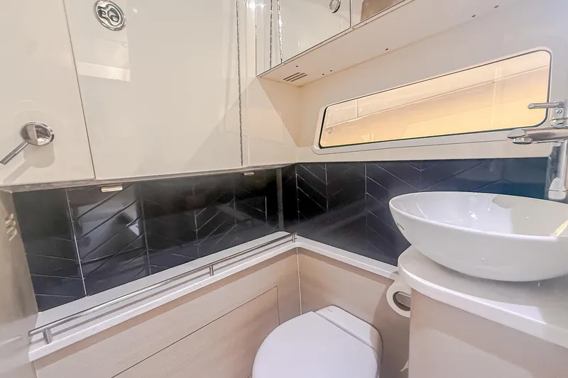Slide: The Image of Luxurious bathroom interior of 2024 Scout 377 LXF boat with modern fixtures. - 85