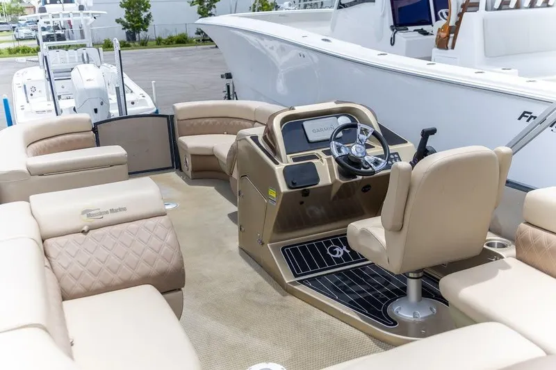 Slide: The Image of 2022 Massimo Marine P-23 MAX Limited boat interior with beige seating and steering console. - 6
