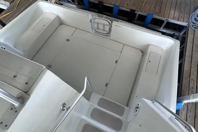 Slide: The Image of 1994 Mainship 40 Sedan Bridge boat deck with seating and storage compartments. - 18