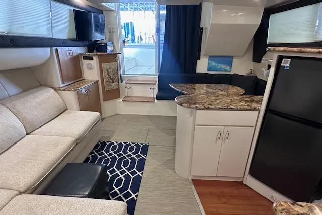 Slide: The Image of Interior of 1994 Mainship 40 Sedan Bridge with modern furnishings and kitchen area. - 21