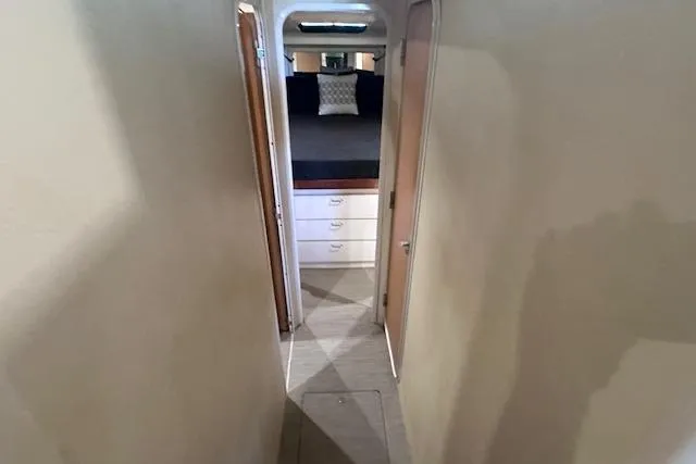 Slide: The Image of Narrow hallway leading to bedroom in 1994 Mainship 40 Sedan Bridge yacht. - 22