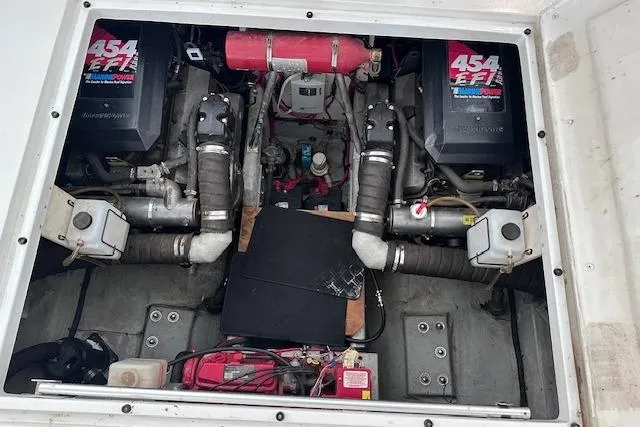 Slide: The Image of Engine compartment of 1994 Mainship 40 Sedan Bridge with dual 454 EFI engines. - 29