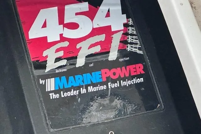 Slide: The Image of MarinePower 454 EFI engine cover on 1994 Mainship 40 Sedan Bridge boat. - 30