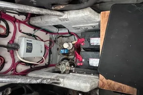 Slide: The Image of Engine compartment of a 1994 Mainship 40 Sedan Bridge with visible wiring and components. - 36