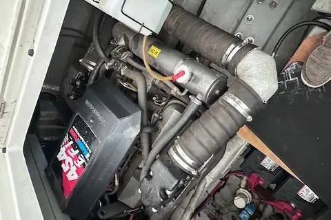 Slide: The Image of Engine compartment of a 1994 Mainship 40 Sedan Bridge with visible components and wiring. - 37