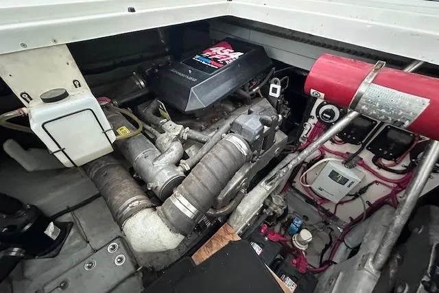 Slide: The Image of Engine room of 1994 Mainship 40 Sedan Bridge, showcasing mechanical components and systems. - 38