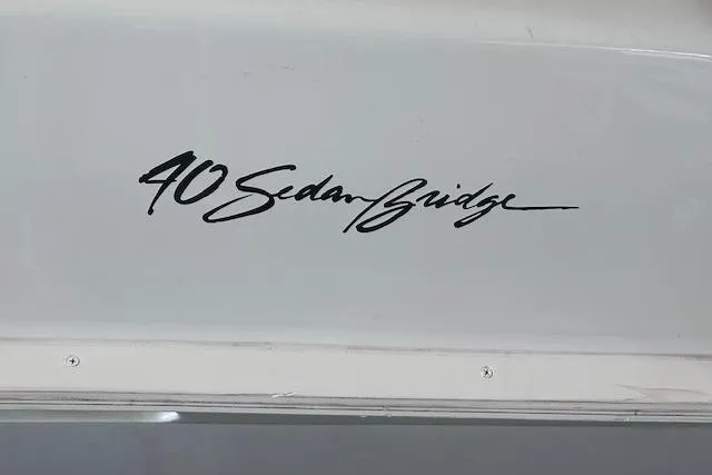Slide: The Image of 1994 Mainship 40 Sedan Bridge logo on boat exterior. - 7