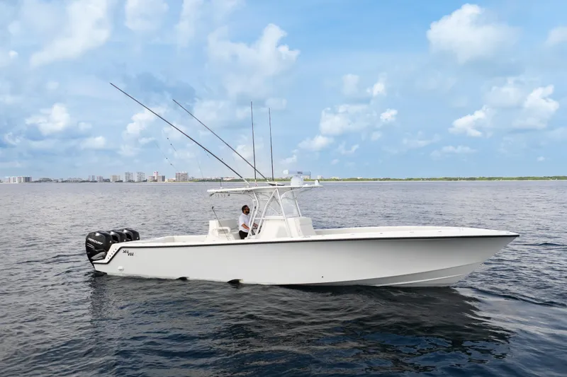 The Image of 2015 SeaVee 390Z boat on calm water, surrounded by tropical scenery. - 0