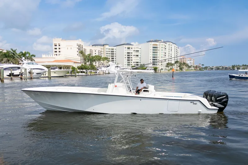 Slide: The Image of Aerial view of 2015 SeaVee 39Z boat cruising on water with triple engines. - 10