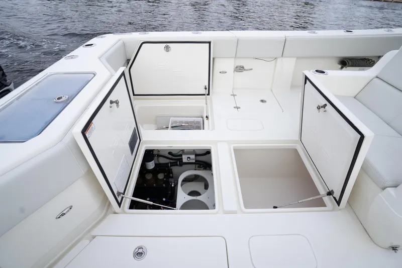 Slide: The Image of 2015 SeaVee 39Z boat dashboard with steering wheel and navigation controls. - 19