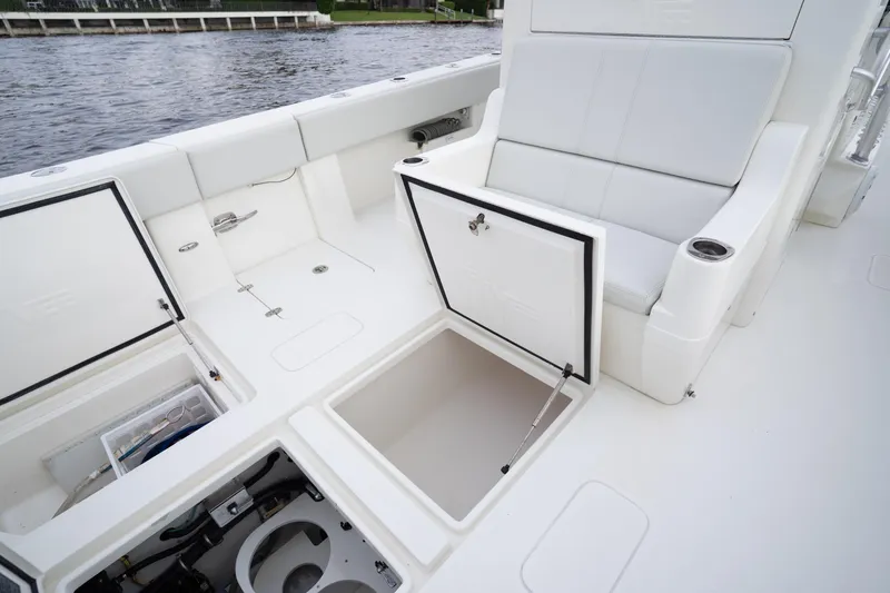 Slide: The Image of 2015 SeaVee 39Z boat compartments open, revealing storage and mechanical systems. - 21