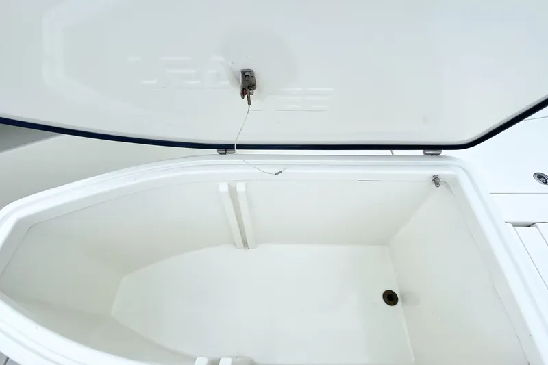 Slide: The Image of 2015 SeaVee 39Z boat deck with open storage compartments and seating. - 24