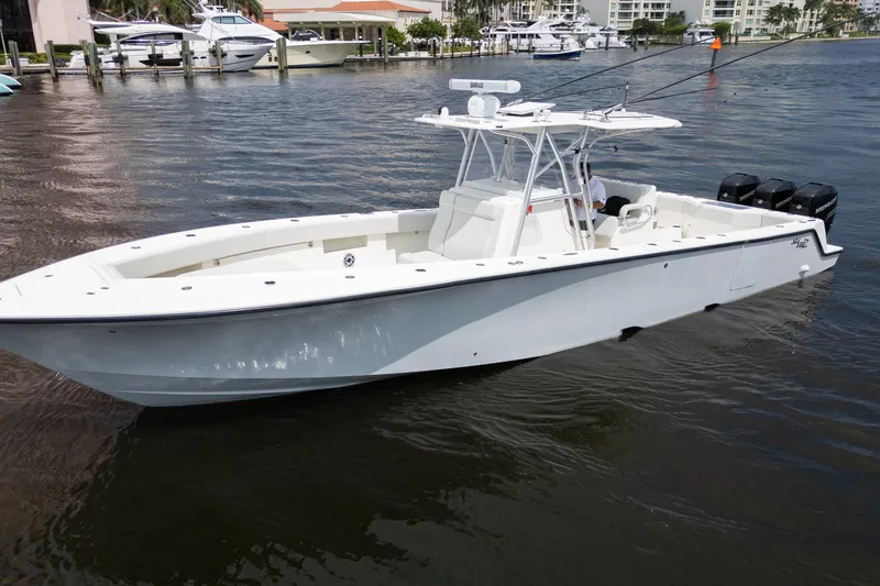 Slide: The Image of 2015 SeaVee 39Z boat on water, featuring sleek design and spacious deck. - 56